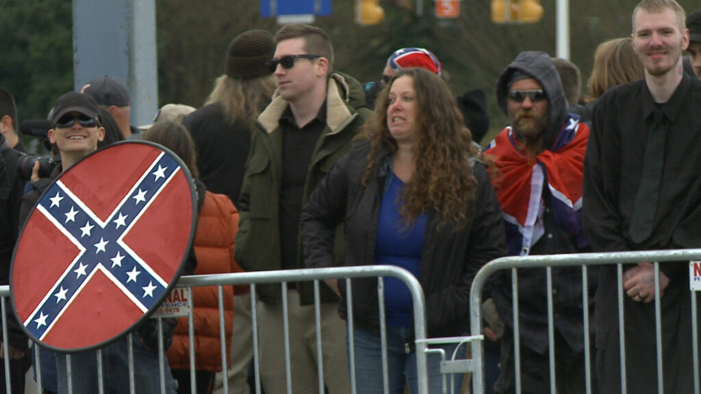 Angry-woman-smiling-guy-confed-flag